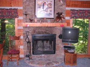 A Mountain Romance Family Room with Stone Fireplace