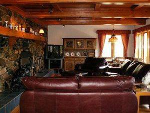 Chalet Senner - Family Room with Stone Fireplace