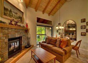 Condo Vacation Rental Living Room with Stone Fireplace