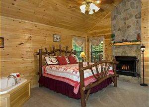 Paradise Cove Cabin view of Bedroom with fire place
