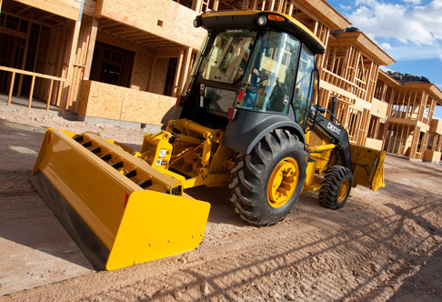 John Deere 210K EP Grading Tractor at work on residential construction site