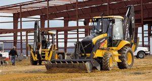 BL 70 Backhoe Rentals in Merced, CA with 4 in 1 Bucket Attachment