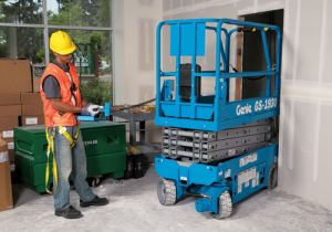 Genie Electric Scissor lift being moved into tight construction space