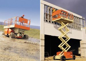 JLG brand scissor lifts moving over rough terrain and working on building