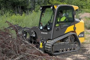 Volvo made Tracked Skid Steer with grappler attachment