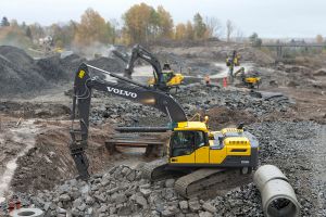 Several Volvo manufactured excavators on aggregate construction site